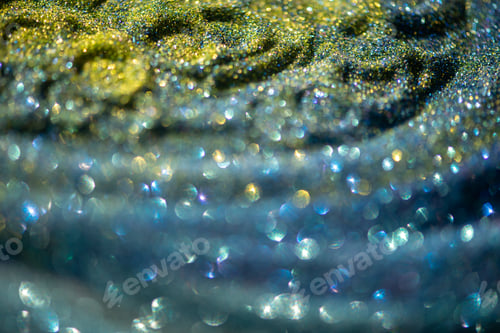 Preview: Shiny yellow blue turquoise glitter textured blurred background
