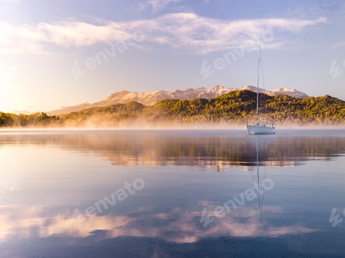 Preview: Sailing boat on misty Lake Nahuel Huapi at sunrise, Villa la Angostura, Neuquen, Patagonia, Argentin