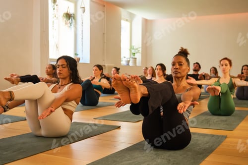 Preview: A group of people are doing Half Boat or Ardha Navasana yoga pose in a room.