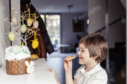 Preview: Child secretly eating Easter cake decoration topping and homemade cookies at home.