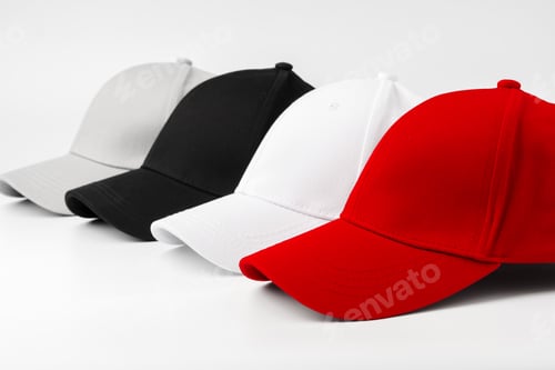 Preview: Lineup of Four Blank Baseball Caps in Red, White, and Black on a White Background