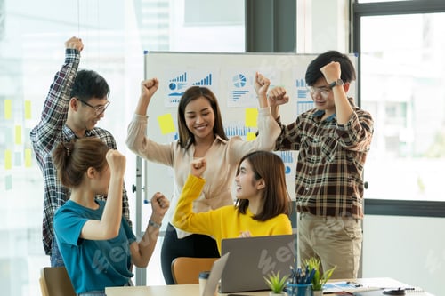 Preview: Group young Asian business people with the creative successful excited raised hands rejoicing.