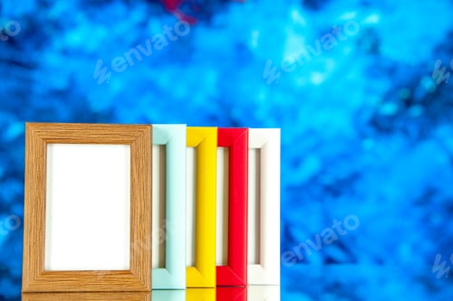 Preview: front view different picture frames with colored corners on blue background color picture shoot
