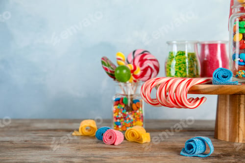 Preview: Composition with many different candies on table. Space for text
