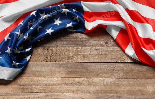 Preview: American flag on a rustic wooden background, copy space. Symbol of independence, patriotism.