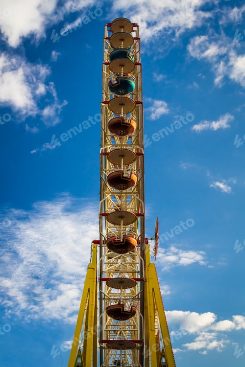 Preview: Amusement park with ferris wheel in summer