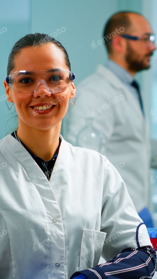 Preview: Laboratory doctor looking at camera smiling