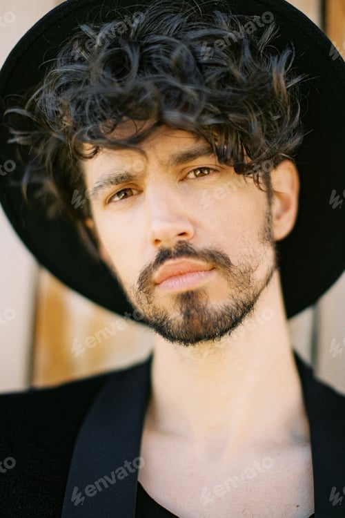 Preview: Portrait of a young man in a black hat and jacket