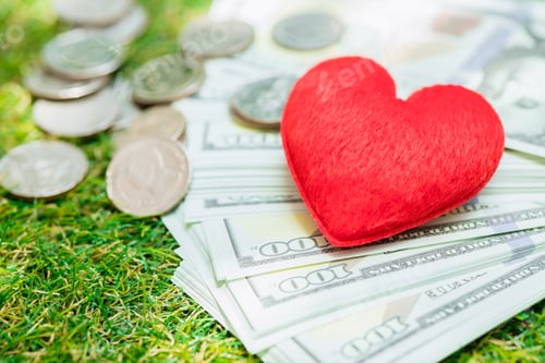 Preview: Love heart with coin money for financial health care and lover together concept.