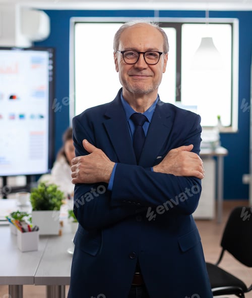 Preview: Portrait of succesful senior entrrepeneur in conference room