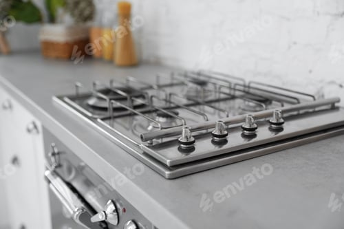 Preview: New modern stove with gas burners in kitchen, closeup