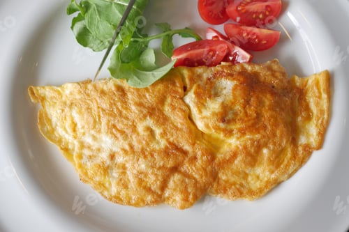 Preview: Egg Omelette and cherry tomato on a plate for morning breakfast