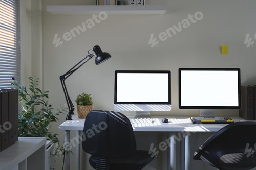Preview: A workspace featuring a two computer monitor, desk lamp, and office supply elements