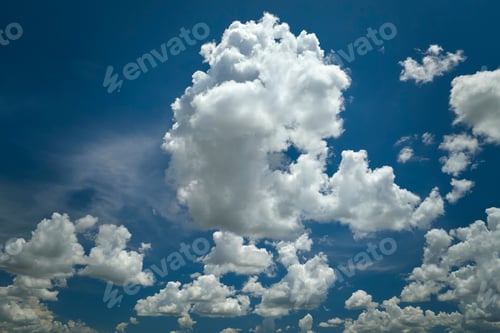 Preview: White puffy cumulus clouds on summer blue sky