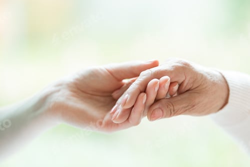 Preview: Young hand holding older one