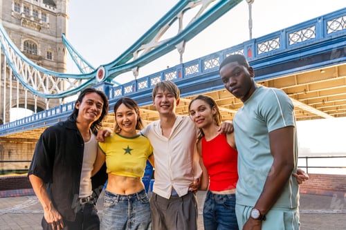 Preview: Multiracial group of happy young friends bonding in London