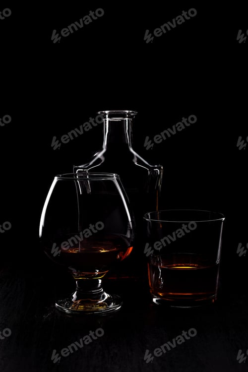 Preview: Glass of whiskey with smoking cigar.