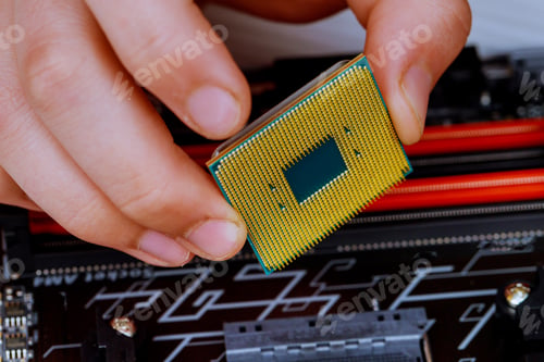 Preview: The technician is putting the CPU on the socket of the computer motherboard