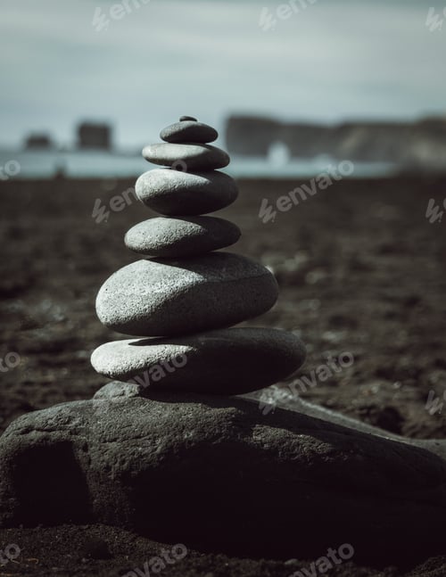 Preview: Cairns on the black sand beach of Reynisfjara.