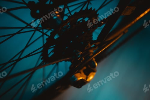 Preview: Closeup shot of the details of a bicycle wheel on a blue background
