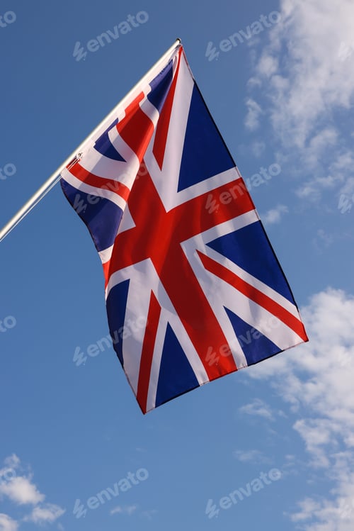 Preview: UK British flag hanging on flagstaff