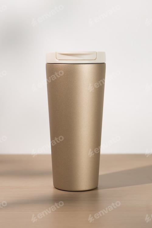Preview: Tan Tumbler with Beige Lid on Wood Surface