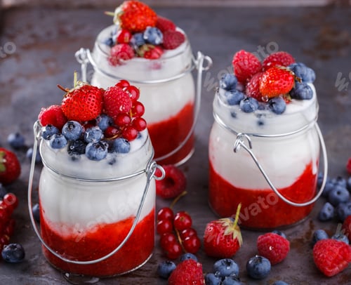 Preview: Yogurt,homemade,with fresh berries, berry puree in a glass container.Healthy eating.