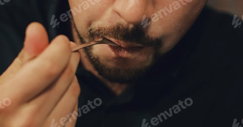 Preview: Attractive Man With A Beard Eating A Piece Of Cake In A Cafe. A Male Is Having Breakfast In A