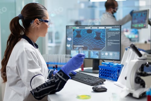 Preview: Biologist researcher holding blood test tube analyzing dna medical expertise