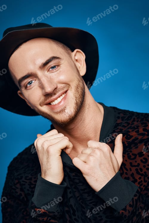 Preview: Cheerful man in black hat fashion modern style posing