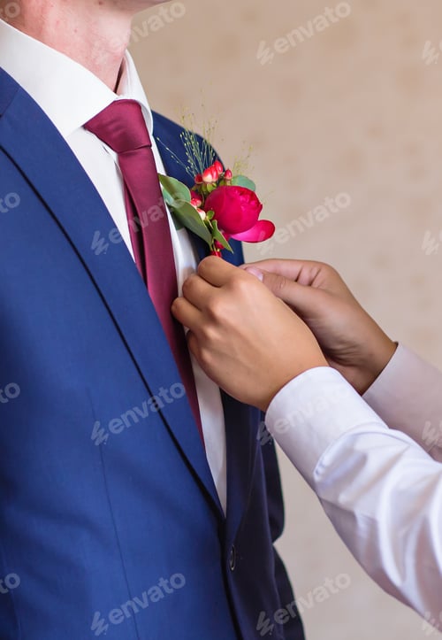 Preview: Best Man Adjusting Groom's Boutonniere close-up