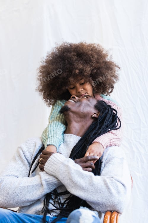 Preview: Black man carrying daughter on hands