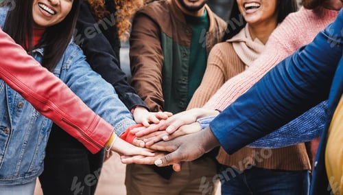 Preview: Happy group of people stacking hands together. Friends team celebrating outside. Diversity