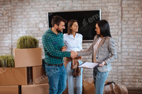 Preview: Young couple buying a new home from the sales agent