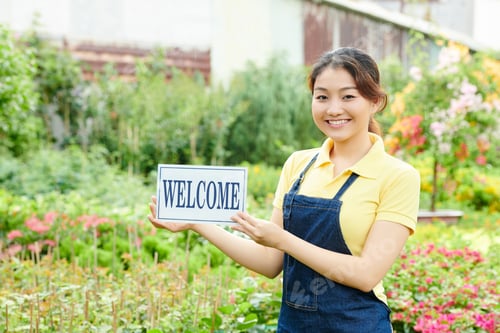 Preview: Young Woman Welcoming Customers
