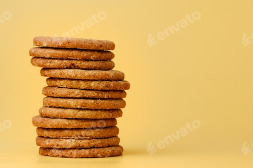 Preview: Stack of round oat cookies on paper background