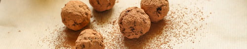 Preview: Candy Dressing Cocoa (Dried Fruit Filling) Sweets On A Dark Background. Top View. Copy Space