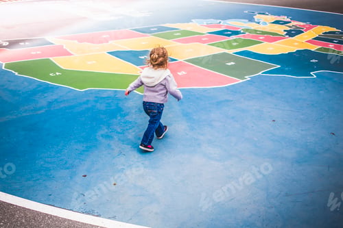 Preview: Toddler walking over map of USA in playground