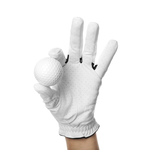 Preview: Player holding golf ball on white background, closeup
