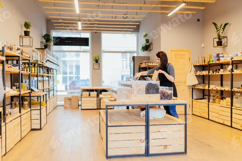 Preview: Wooden shelves with different food goods and personal hygiene or cosmetics products in grocery store
