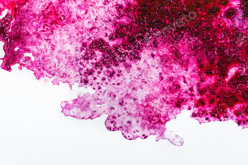 Preview: top view of pink watercolor spill on white background