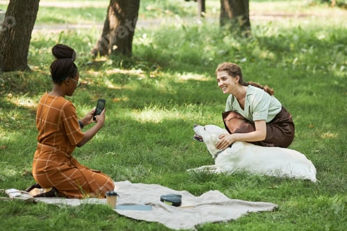 Preview: Young Women with Dog in Park