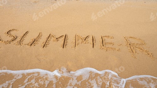 Preview: Summer written in sand with ocean wave approaching on beach