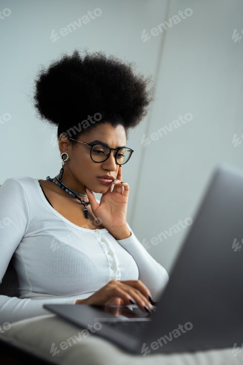 Preview: Woman Works on Laptop at Home in Daylight