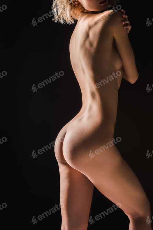 Preview: partial view of nude sexy young woman isolated on black