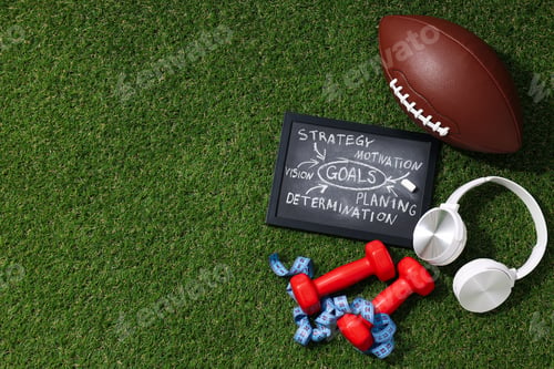 Preview: Black board with goal plan on grass with rugby ball