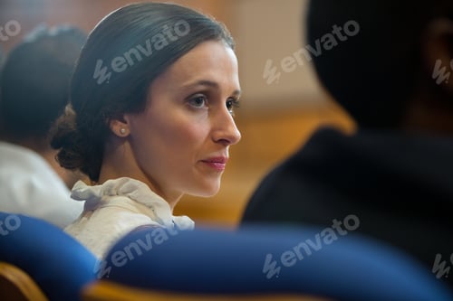 Preview: Female business executives listening to speech