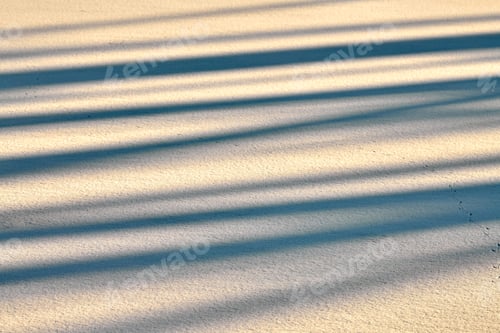Preview: Abstract shadow lines on winter snow background