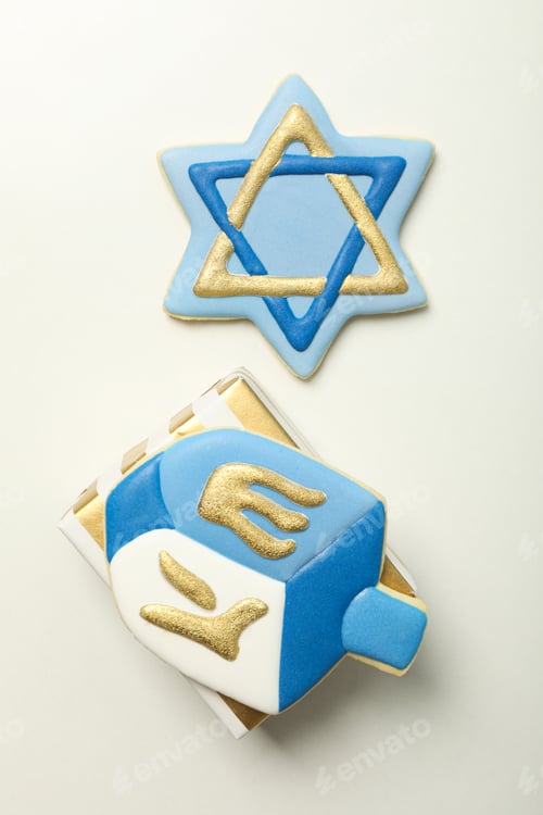 Preview: Gingerbread cookies with Jewish symbols on white background, top view