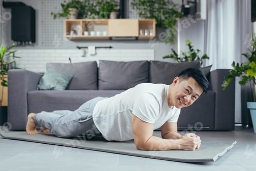 Preview: Asian performs morning exercises, bar on the floor, male athlete athlete exercises